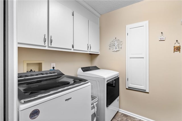 15067 Beacon Ridge Dr, Seneca, SC 29678 - laundry area with cabinet space, washer and clothes dryer, and a textured ceiling