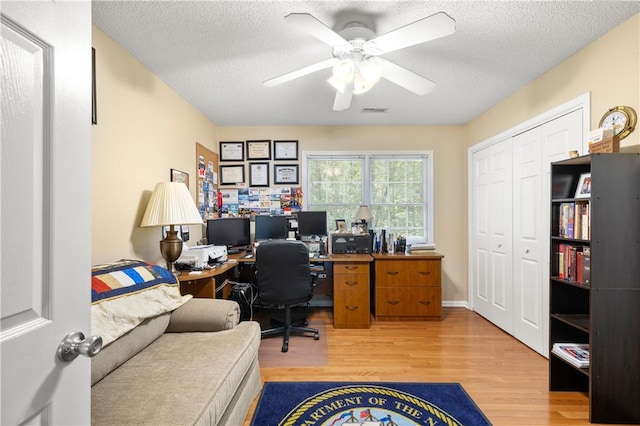 15067 Beacon Ridge Dr, Seneca, SC 29678 - home office featuring wood finished floors, a ceiling fan, and a textured ceiling