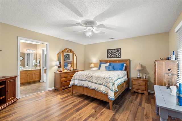 15067 Beacon Ridge Dr, Seneca, SC 29678 - bedroom featuring light wood-style floors, ensuite bathroom, a ceiling fan, and a textured ceiling