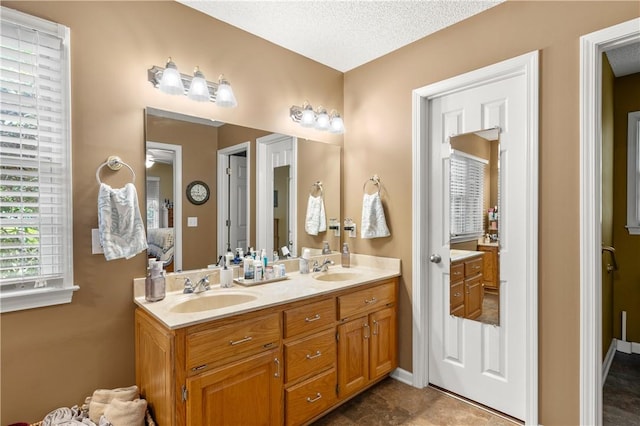 15067 Beacon Ridge Dr, Seneca, SC 29678 - bathroom with double vanity and a textured ceiling
