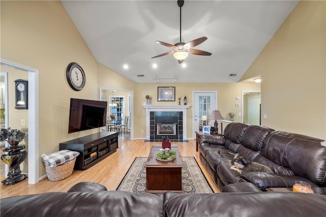 15067 Beacon Ridge Dr, Seneca, SC 29678 - living room with a ceiling fan, wood finished floors, high vaulted ceiling, and a tiled fireplace