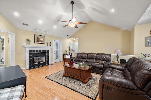 15067 Beacon Ridge Dr, Seneca, SC 29678 - living room featuring lofted ceiling, ceiling fan, wood finished floors, a tile fireplace, and recessed lighting
