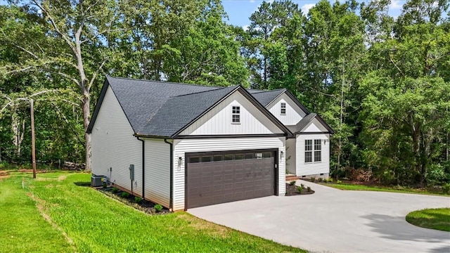 1205 Ramona Dr, Belton, SC 29627 - modern inspired farmhouse with concrete driveway, an attached garage, a front yard, and view of scattered trees