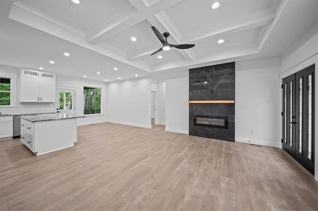 1205 Ramona Dr, Belton, SC 29627 - unfurnished living room with light wood finished floors, ceiling fan, a high end fireplace, recessed lighting, and beamed ceiling