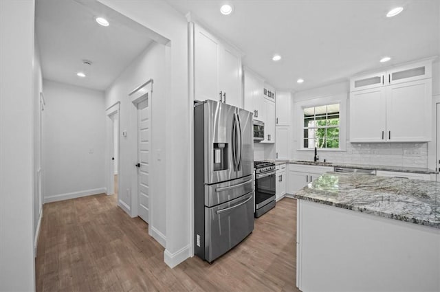 1205 Ramona Dr, Belton, SC 29627 - kitchen featuring stainless steel appliances, recessed lighting, light wood-style floors, white cabinetry, and light stone counters