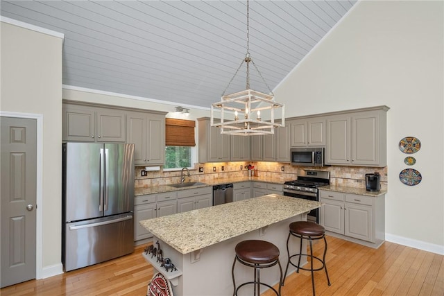 209 Falcon Crest Way, Pickens, SC 29671 - kitchen featuring appliances with stainless steel finishes, gray cabinetry, light wood-style floors, high vaulted ceiling, and a chandelier
