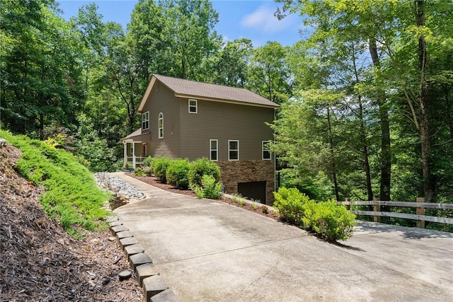 209 Falcon Crest Way, Pickens, SC 29671 - view of home's exterior with stone siding, concrete driveway, and an attached garage