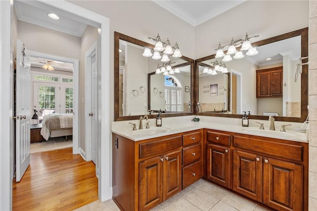 220 Thomas Welborn Rd, Anderson, SC 29625 - ensuite bathroom with crown molding, double vanity, a ceiling fan, a chandelier, and tile patterned floors