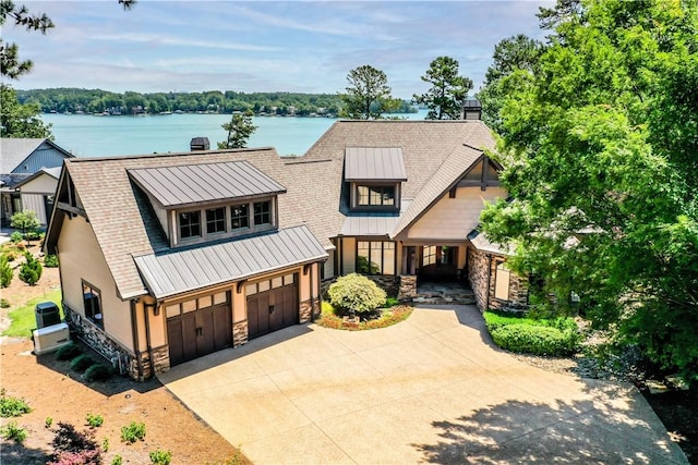 124 Pineridge Pointe Dr, Seneca, SC 29672 - view of front of property featuring stone siding, a chimney, driveway, and a standing seam roof