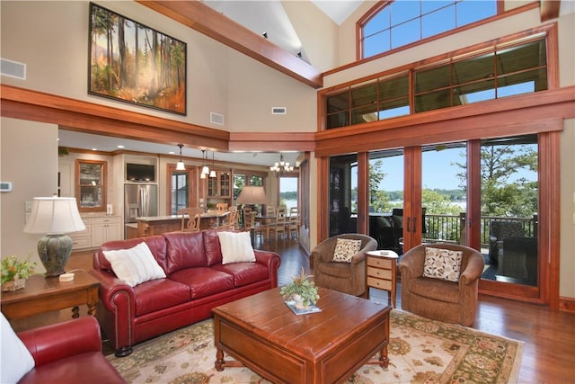 124 Pineridge Pointe Dr, Seneca, SC 29672 - living room with wood finished floors, plenty of natural light, high vaulted ceiling, and a chandelier