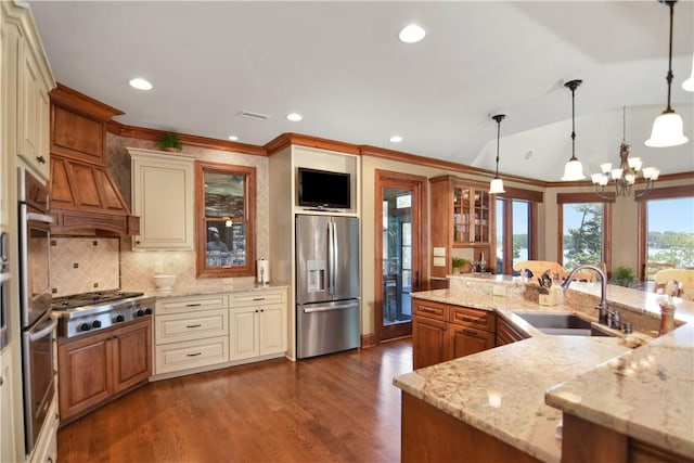 124 Pineridge Pointe Dr, Seneca, SC 29672 - kitchen featuring stainless steel appliances, glass insert cabinets, a chandelier, decorative backsplash, and dark wood-type flooring