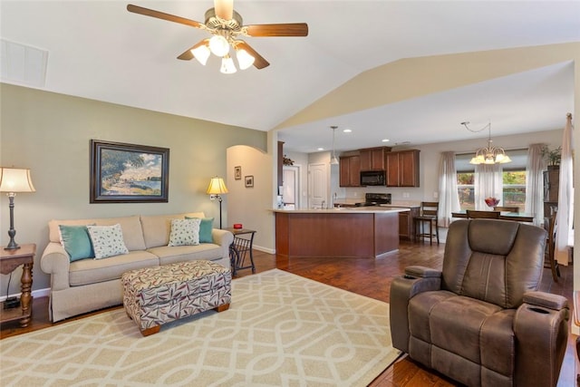 311 Buchanan Trl, Seneca, SC 29678 - living area featuring lofted ceiling, dark wood-style flooring, a ceiling fan, a chandelier, and recessed lighting