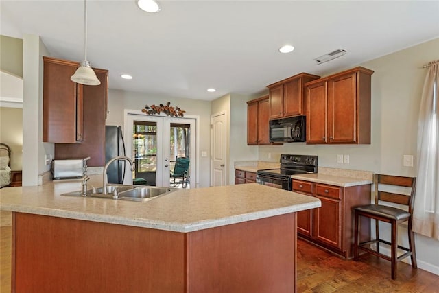 311 Buchanan Trl, Seneca, SC 29678 - kitchen featuring black appliances, light countertops, a peninsula, recessed lighting, and decorative light fixtures