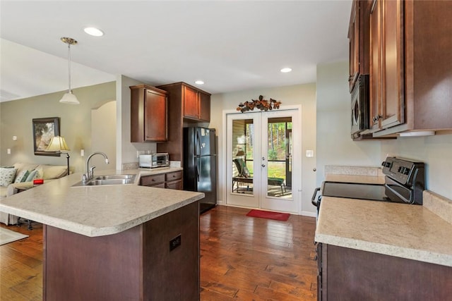 311 Buchanan Trl, Seneca, SC 29678 - kitchen with freestanding refrigerator, electric range oven, light countertops, a peninsula, and recessed lighting
