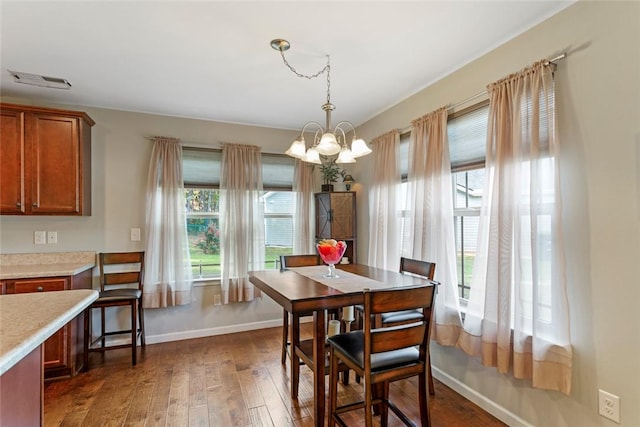 311 Buchanan Trl, Seneca, SC 29678 - dining area with healthy amount of natural light, dark wood-style flooring, and a chandelier