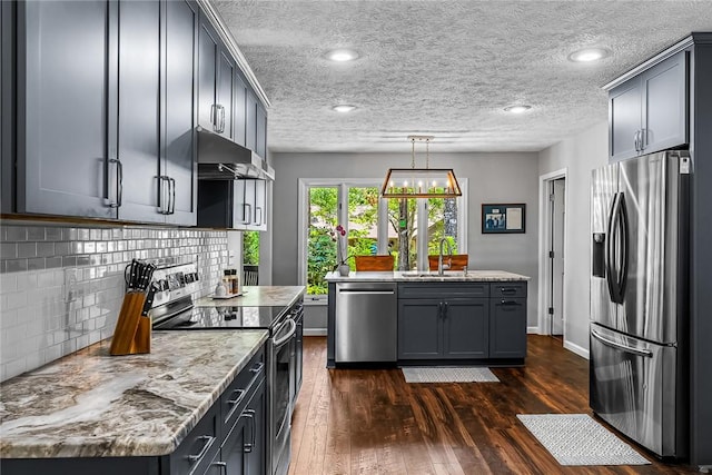7 Drifter Ln, Salem, SC 29676 - kitchen featuring appliances with stainless steel finishes, under cabinet range hood, dark wood-style floors, backsplash, and pendant lighting