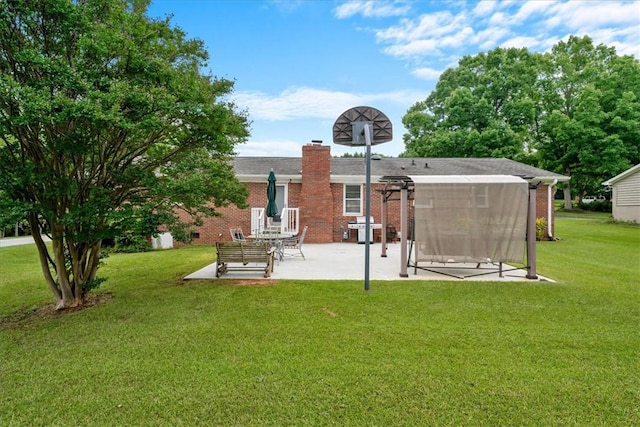200 Camille St, Easley, SC 29642 - back of house with a patio, brick siding, a chimney, and a yard
