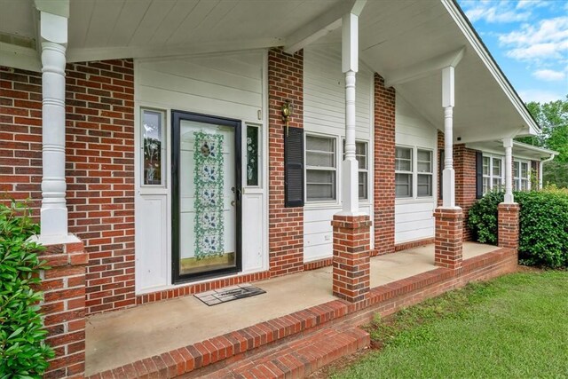 200 Camille St, Easley, SC 29642 - doorway to property with a porch and brick siding