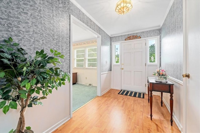200 Camille St, Easley, SC 29642 - foyer entrance with wallpapered walls, light wood-style flooring, crown molding, and healthy amount of natural light