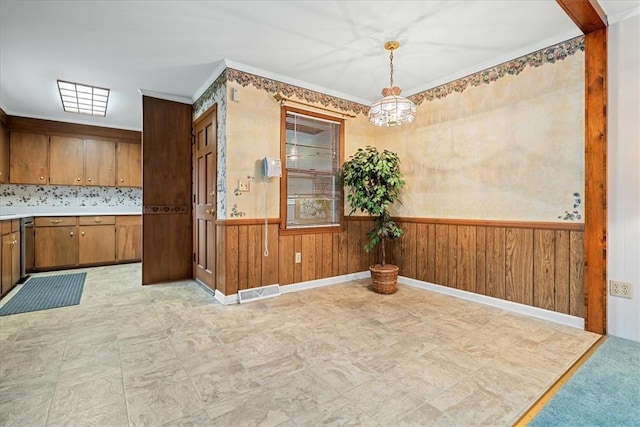 200 Camille St, Easley, SC 29642 - unfurnished dining area with a wainscoted wall, a chandelier, and wood walls