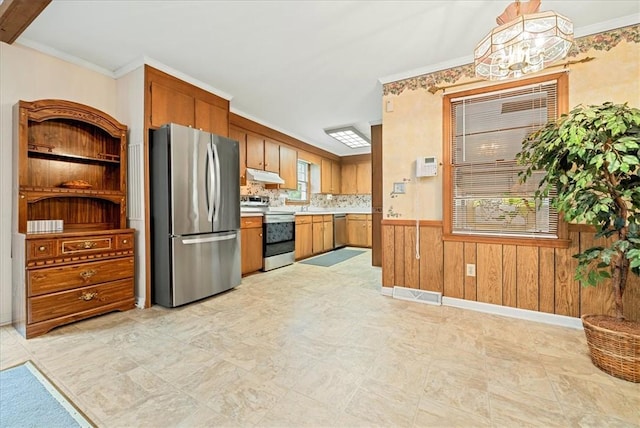 200 Camille St, Easley, SC 29642 - kitchen with stainless steel appliances, under cabinet range hood, light countertops, wooden walls, and a chandelier