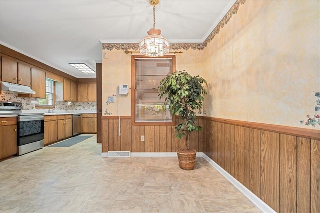 200 Camille St, Easley, SC 29642 - kitchen with stainless steel appliances, under cabinet range hood, a chandelier, wainscoting, and light countertops