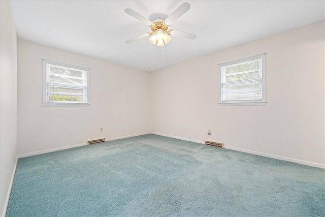 200 Camille St, Easley, SC 29642 - spare room featuring plenty of natural light, carpet floors, and a ceiling fan