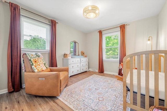 215 Ridgecrest Dr, Easley, SC 29640 - bedroom with wood finished floors and a nursery area