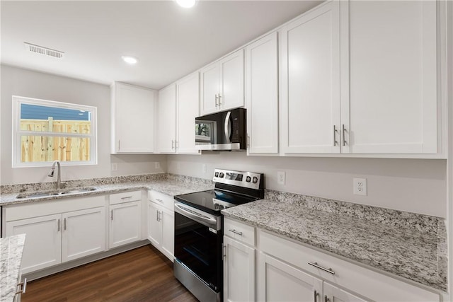418 Kensington Cir Lot 19, Seneca, SC 29672 - kitchen with stainless steel range with electric cooktop, white cabinetry, dark wood-style floors, light stone counters, and recessed lighting