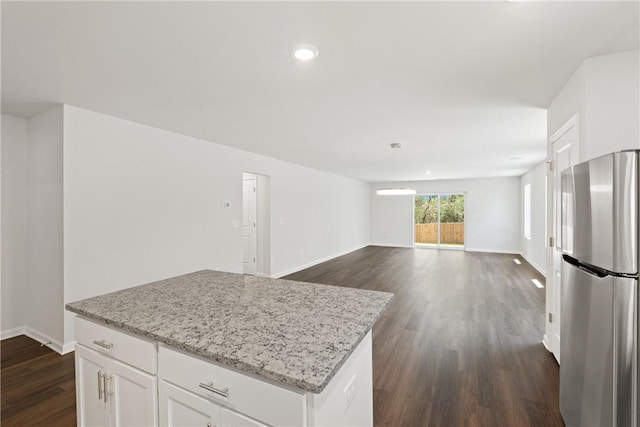 418 Kensington Cir Lot 19, Seneca, SC 29672 - kitchen with freestanding refrigerator, dark wood-type flooring, a center island, white cabinets, and light stone countertops