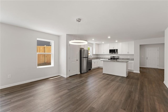 418 Kensington Cir Lot 19, Seneca, SC 29672 - kitchen with appliances with stainless steel finishes, white cabinets, recessed lighting, dark wood-style flooring, and a center island