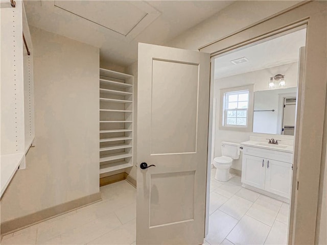 600 S Stribling St, Seneca, SC 29678 - bathroom with vanity, tile patterned floors, and a walk in closet