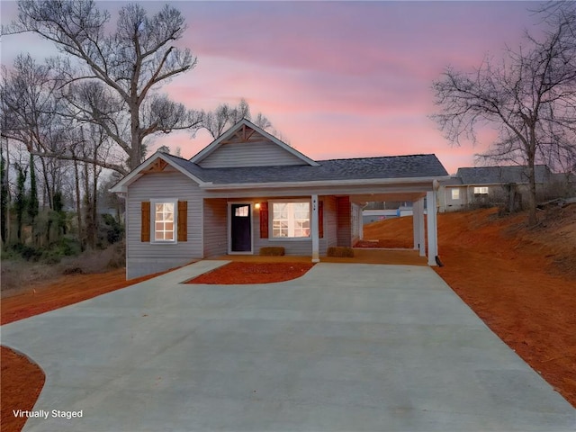 600 S Stribling St, Seneca, SC 29678 - view of front facade with driveway, a shingled roof, a porch, and an attached carport