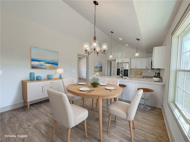 600 S Stribling St, Seneca, SC 29678 - dining room featuring lofted ceiling, a chandelier, and light wood finished floors