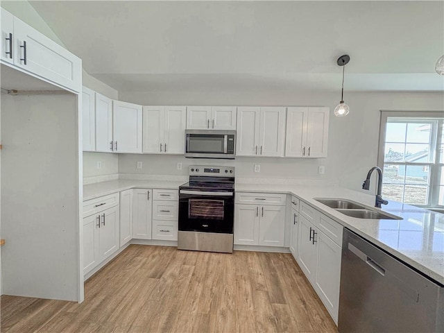600 S Stribling St, Seneca, SC 29678 - kitchen featuring stainless steel appliances, light wood-style flooring, and white cabinetry