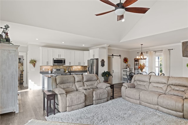 500 Serria Way, Seneca, SC 29678 - living room with a barn door, ceiling fan, wood finished floors, recessed lighting, and a chandelier