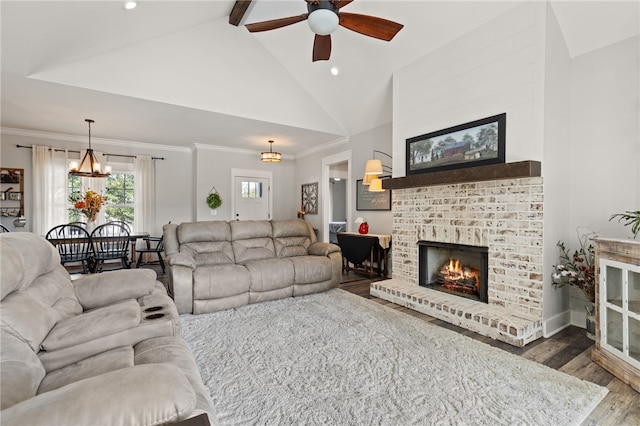 500 Serria Way, Seneca, SC 29678 - living area featuring wood finished floors, ceiling fan, a brick fireplace, beam ceiling, and a chandelier