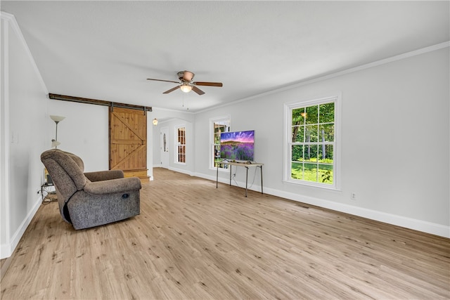 1399 Lake Jemiki Rd, Walhalla, SC 29691 - sitting room featuring ornamental molding, a barn door, light wood-type flooring, and a ceiling fan