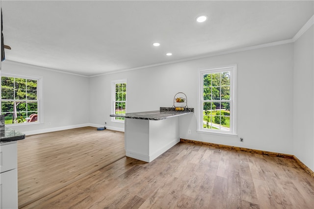 1399 Lake Jemiki Rd, Walhalla, SC 29691 - kitchen featuring ornamental molding, light wood finished floors, a peninsula, recessed lighting, and dark stone counters