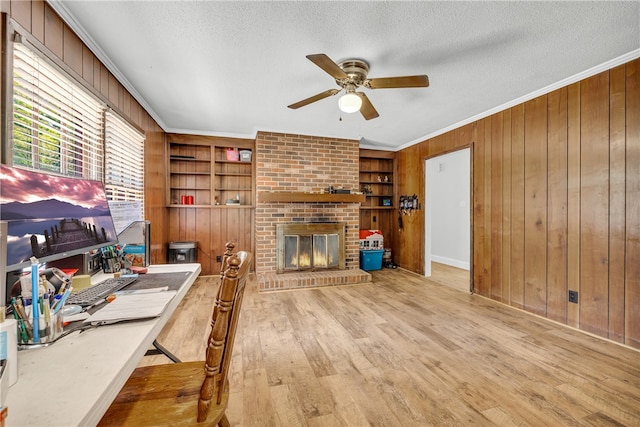 1399 Lake Jemiki Rd, Walhalla, SC 29691 - office featuring a ceiling fan, wooden walls, a textured ceiling, crown molding, and wood finished floors