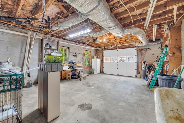 1399 Lake Jemiki Rd, Walhalla, SC 29691 - garage featuring freestanding refrigerator and a garage door opener