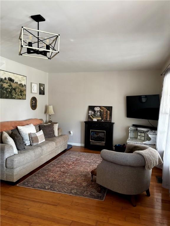 1430 W Main St, West Union, SC 29696 - living area with wood-type flooring and a chandelier