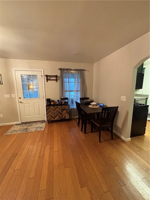 1430 W Main St, West Union, SC 29696 - dining space featuring arched walkways and hardwood / wood-style floors