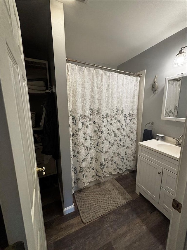 1430 W Main St, West Union, SC 29696 - bathroom featuring vanity, wood finished floors, and a shower with curtain
