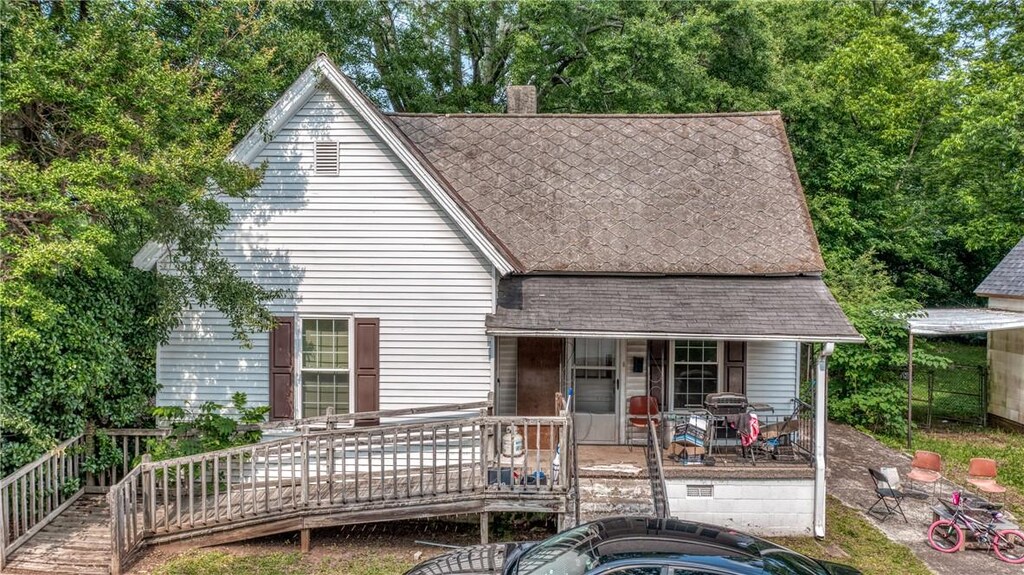 308 F St, Anderson, SC 29625 - view of front of house featuring roof with shingles and a chimney
