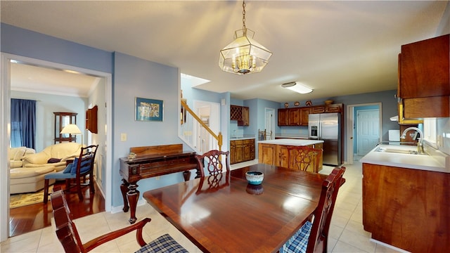 210 Wakefield Dr, Seneca, SC 29678 - dining space featuring a chandelier, stairs, and light tile patterned flooring