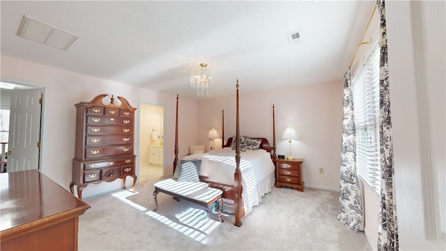 210 Wakefield Dr, Seneca, SC 29678 - bedroom featuring light carpet, a chandelier, and ensuite bath