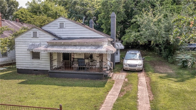 1105 W End Ave, Anderson, SC 29625 - rear view of house featuring a yard, a porch, a chimney, and crawl space