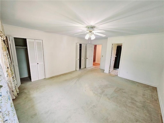 150 Prater Dr, Seneca, SC 29678 - unfurnished bedroom with carpet floors, two closets, ornamental molding, and ceiling fan