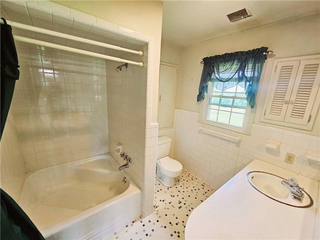 150 Prater Dr, Seneca, SC 29678 - bathroom with tile walls, shower / washtub combination, and a wainscoted wall